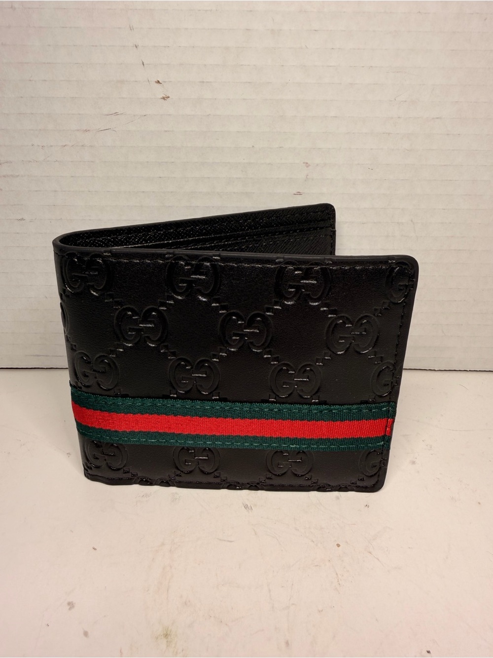 Gucci GG Embossed Leather
Web Bifold Wallet Black